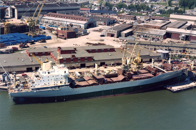 The container ship 'Jacek Malczewski' moored alongside the wharf at the  Marine Industries Limited shipyard.