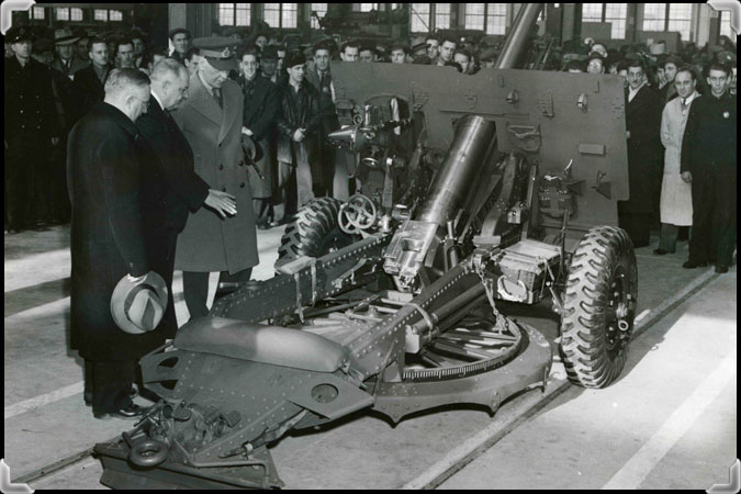 Édouard Simard  presents a prototype of a cannon produced by Sorel Industries Limited to the federal Minister of Justice and the Governor General of Canada.
