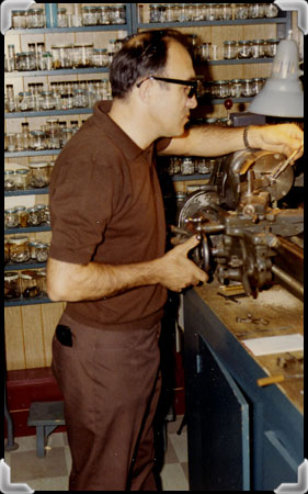 Yvan Demeules building a model in his workshop.