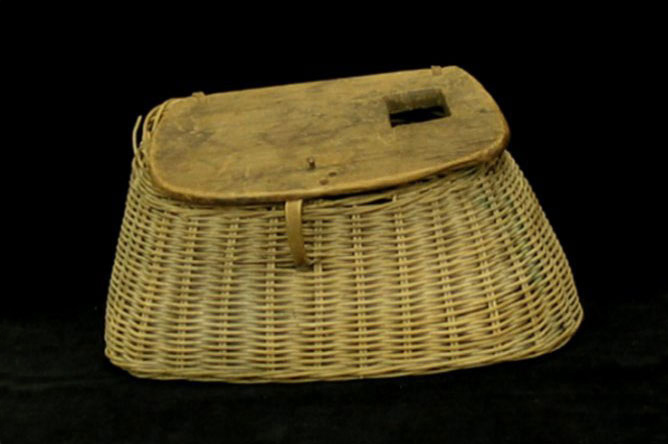 Wood and wicker fishing basket, used to carry fish.