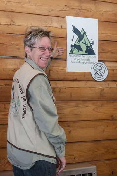 Carole Deschenaux displays the new logo of the Association des chasseurs et pêcheurs de Sainte-Anne-de-Sorel.