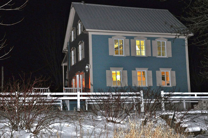 Light blue house on Île d'Embarras in winter