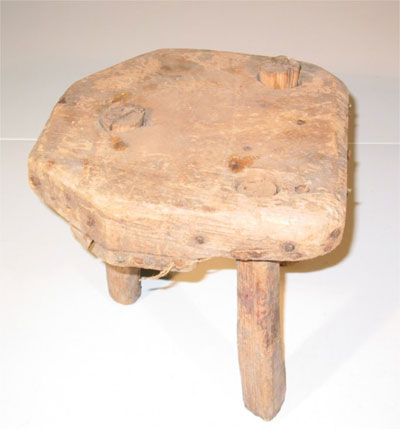 Wooden stool once used for milking.